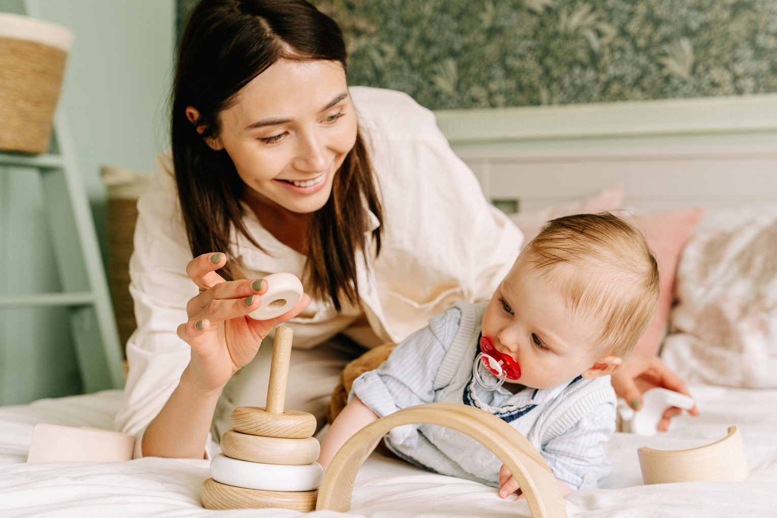 Mother and Baby Boy Playing with Wooden Toy